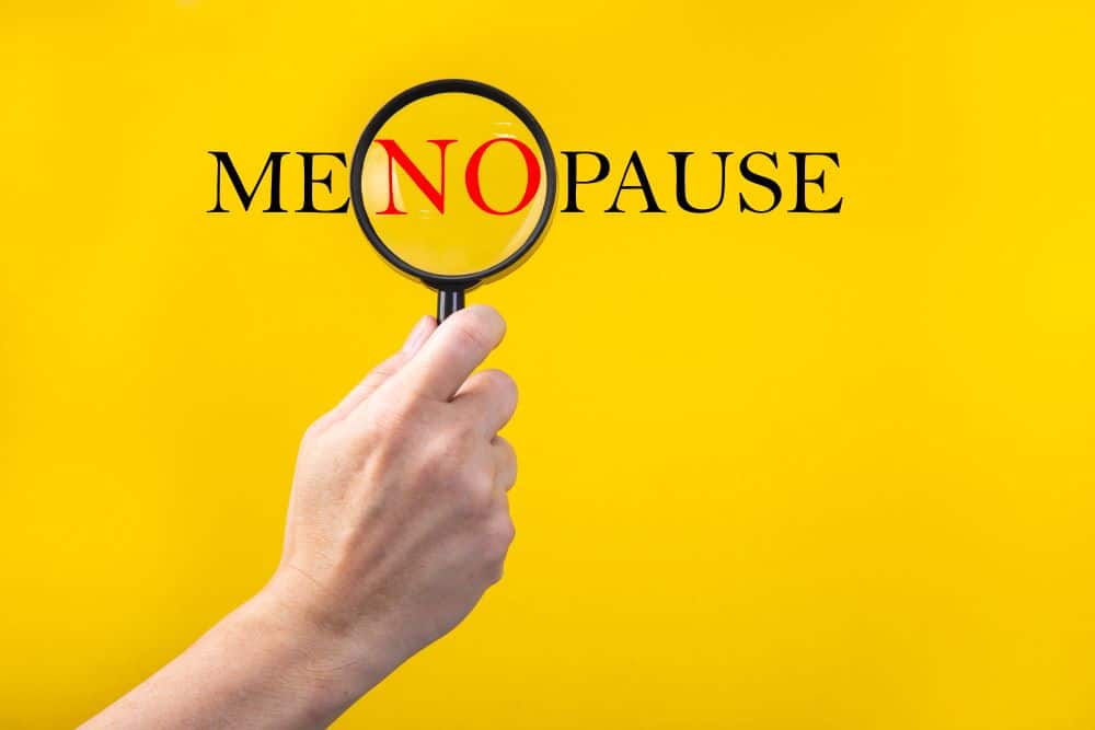a graphic showing the word menopause with "no" magnified to represent the healing power of hormone therapy for menopause
