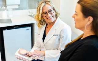 Two women in gynecologist office with mode bladder going over UTI Prevention Tips from ChristiMD Medical Group