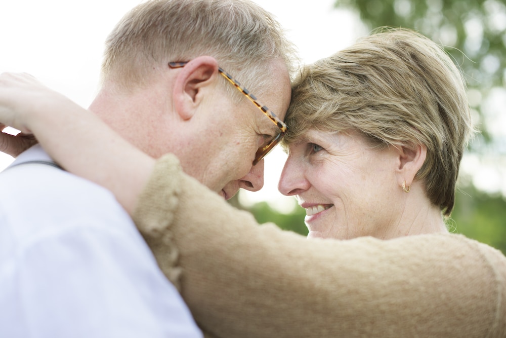 A mature couple enjoy intimate hug with help from vaginal rejuvenation treatments in Katy