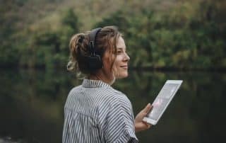 Beautiful woman listening to Podcast