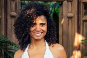A woman who saw a urogynecologist in Houston smiles at the camera.